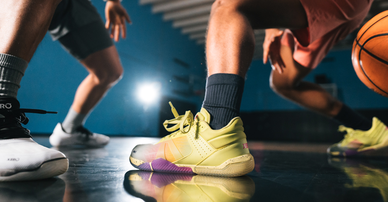 Two basketball players facing off in their X1 Xero Shoes.
