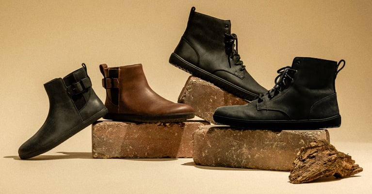 Tari II and Denver II Leather boots on neutral background